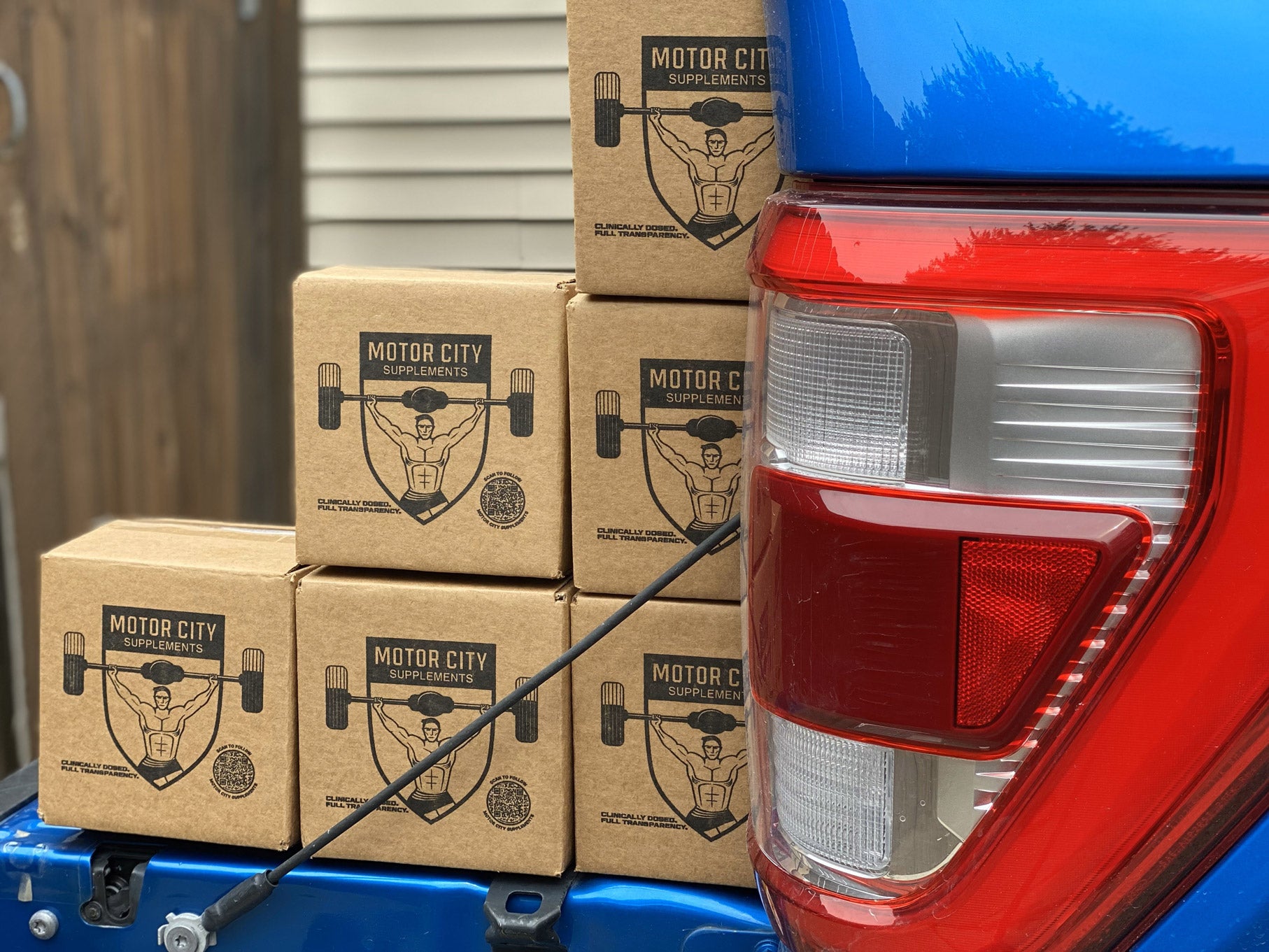 MCS boxes in blue truck bed in stair formation. 