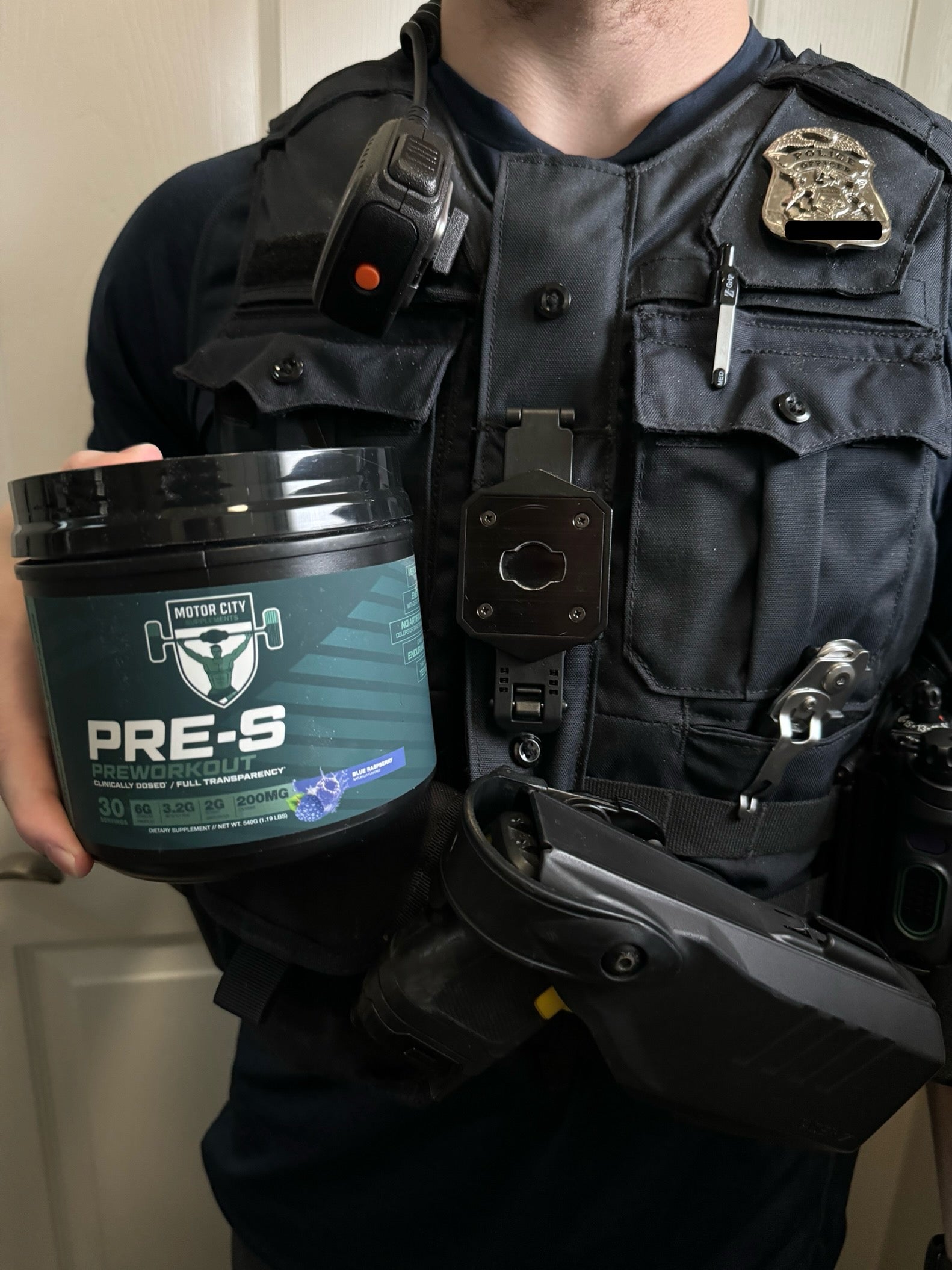 PRE-S product being held by a uniformed police officer. 